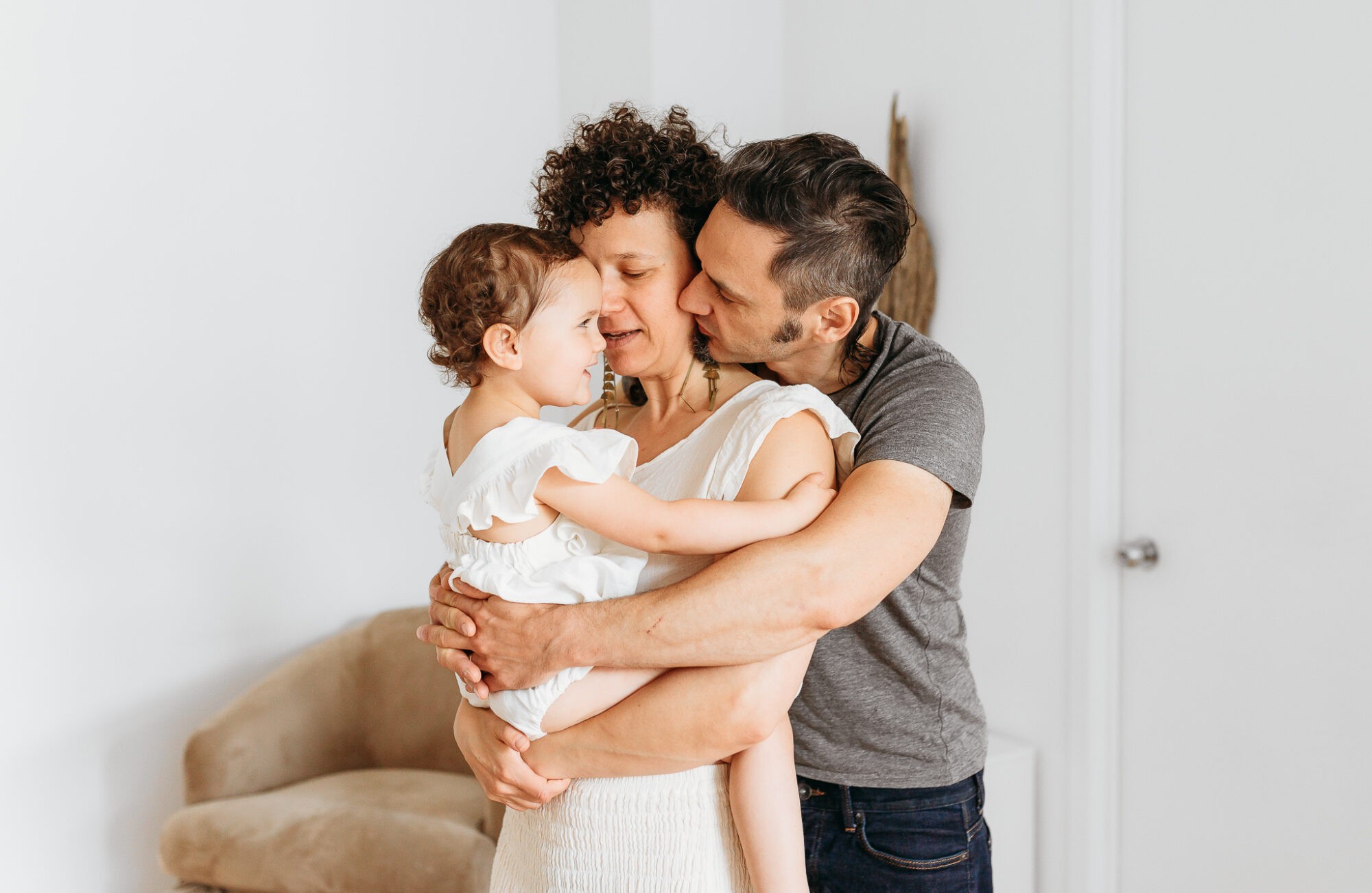 A family snuggles together during their lifestyle family session.