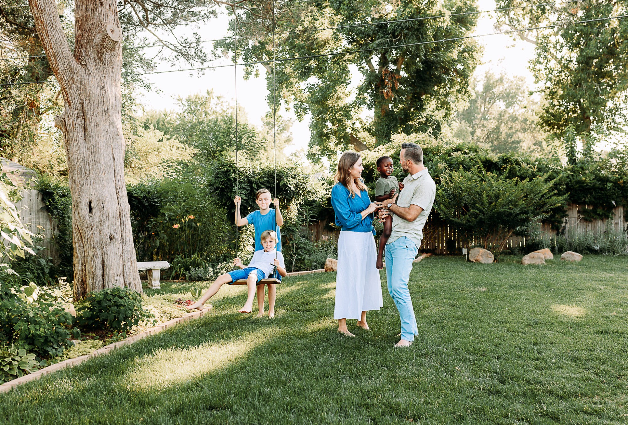 Norman family hangs out in their backyard during their family photo session.