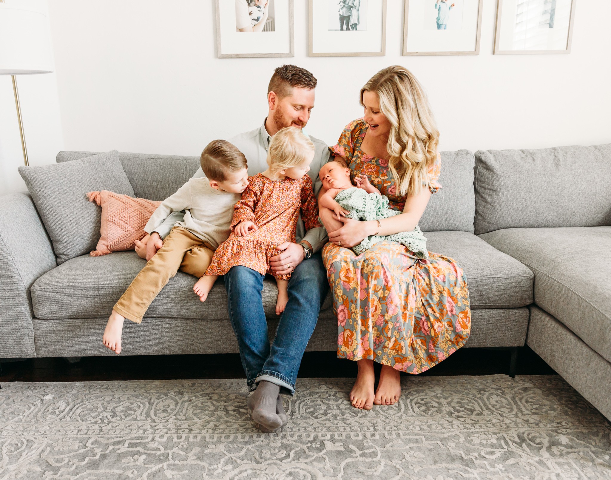 Picture of family on a couch with newborn.