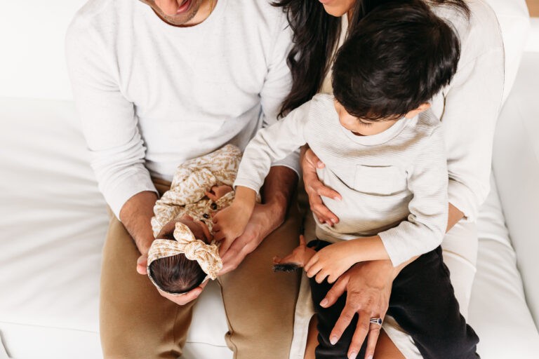 Family on couch during newborn session
