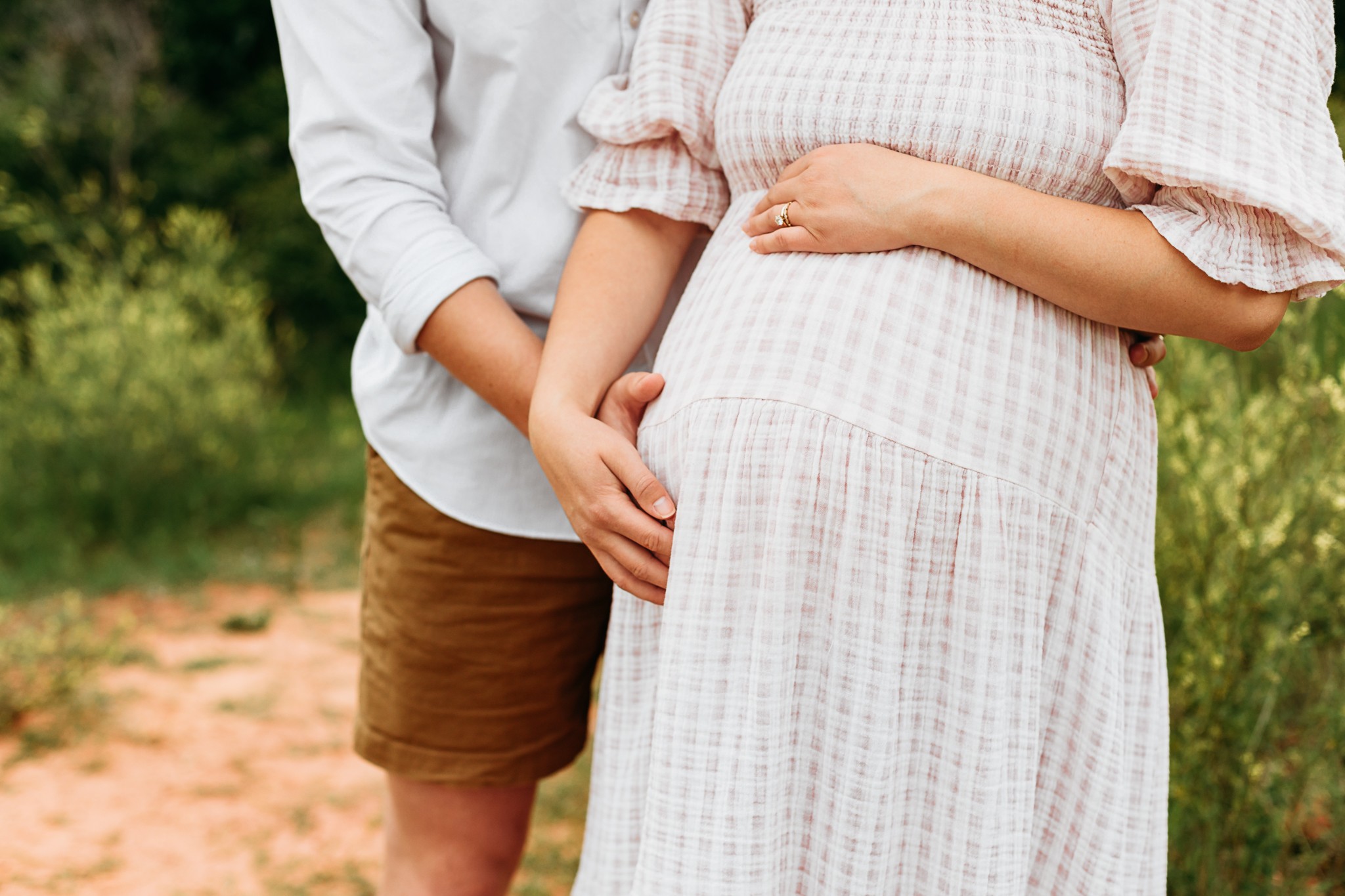 couple with baby bump during photo sessin.